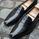 The Darcy penny loafer in black leather calf