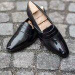 The Darcy penny loafer in black leather calf